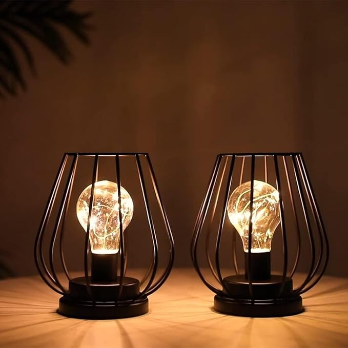 TRIROCKS Set of 2 Metal Battery Operated Lamp 7'' Tall Mini Cage Shape Cordless Table Lamp Battery Lanterns with Warm Fairy Lights Bulb for Patio Garden Wedding Parties Indoor Outdoor(Black)